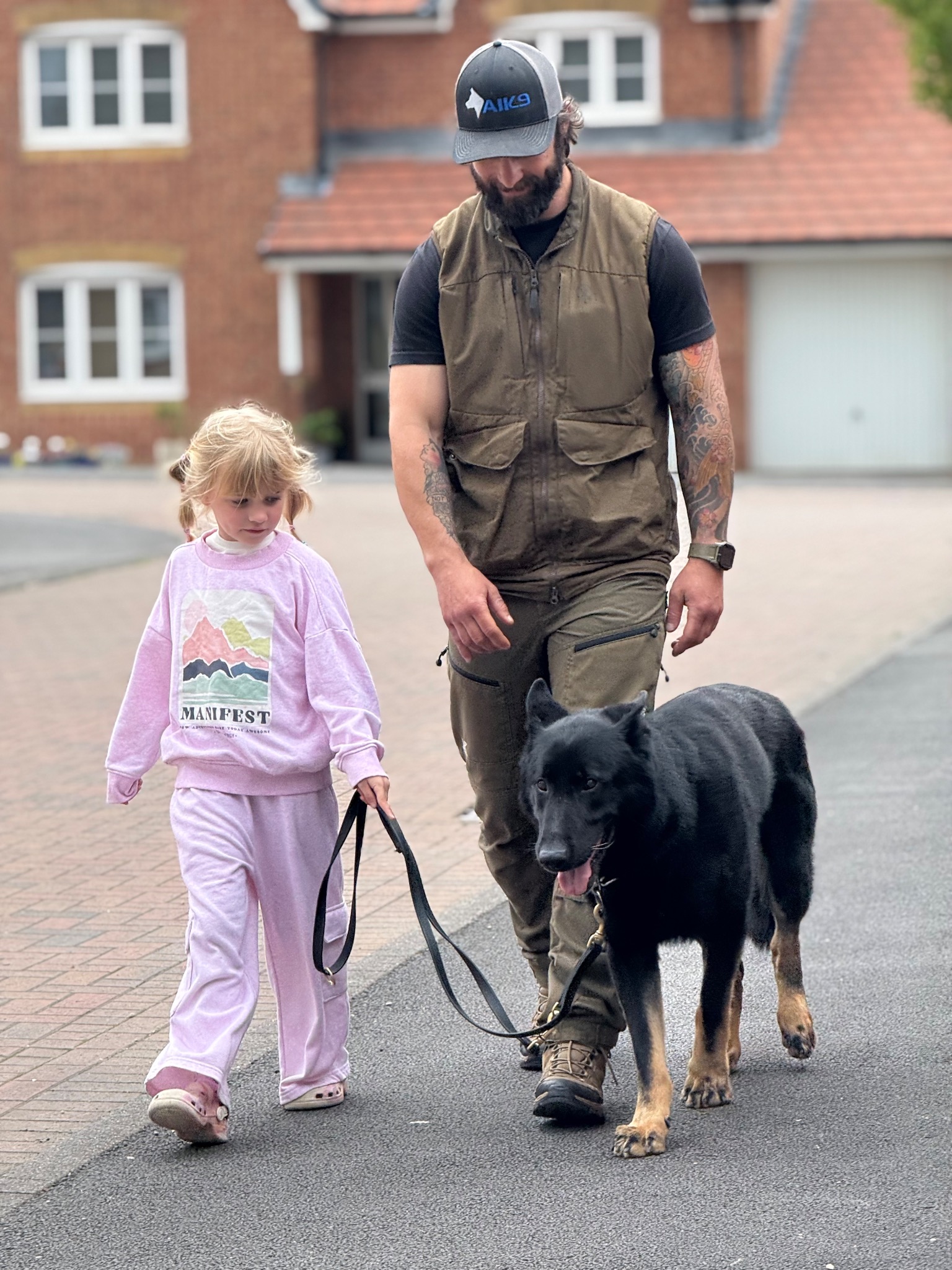 Matt Evans training a dog with a child